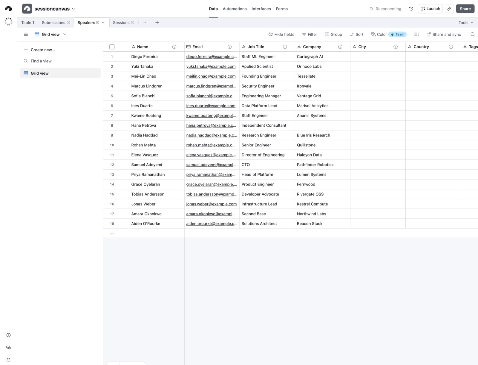 The Speakers mirror table in Airtable listing every speaker with email, job title and company columns